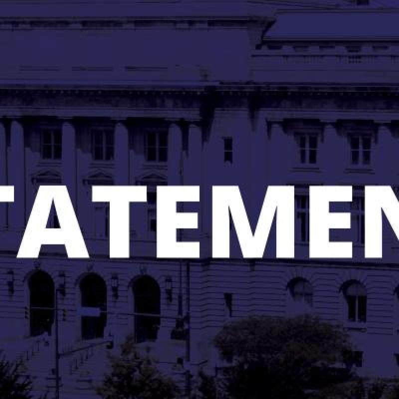 city hall dark blue background white text stating statement