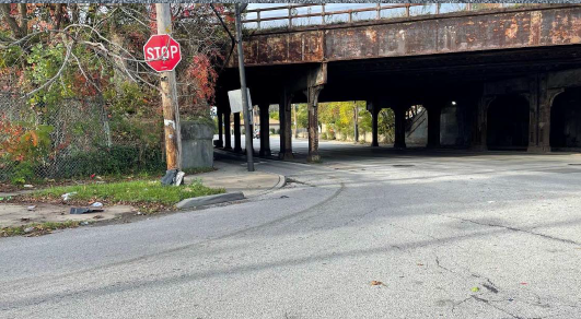 A photo from a side street of St. Clair shows limited site lines from an existing rail bridge.