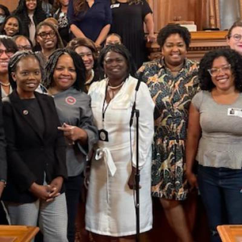 a group of women surround mayor bibb 