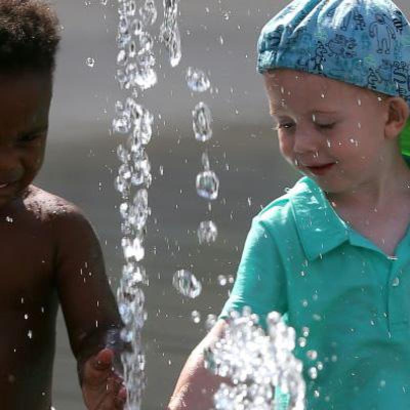 children playing in a fountain