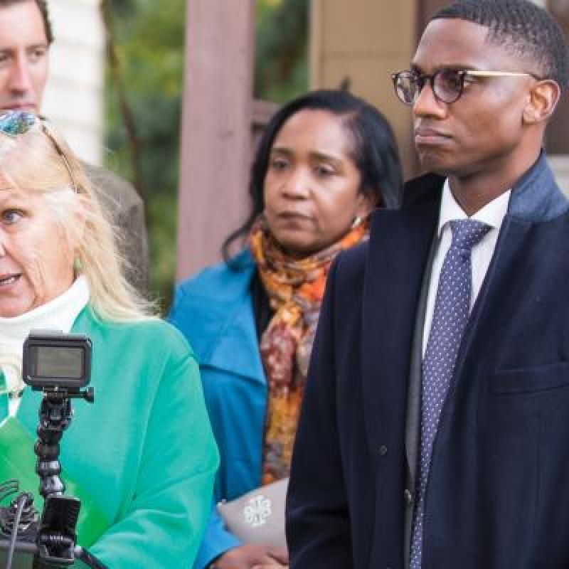 mayor bibb stands next to woman making announcement