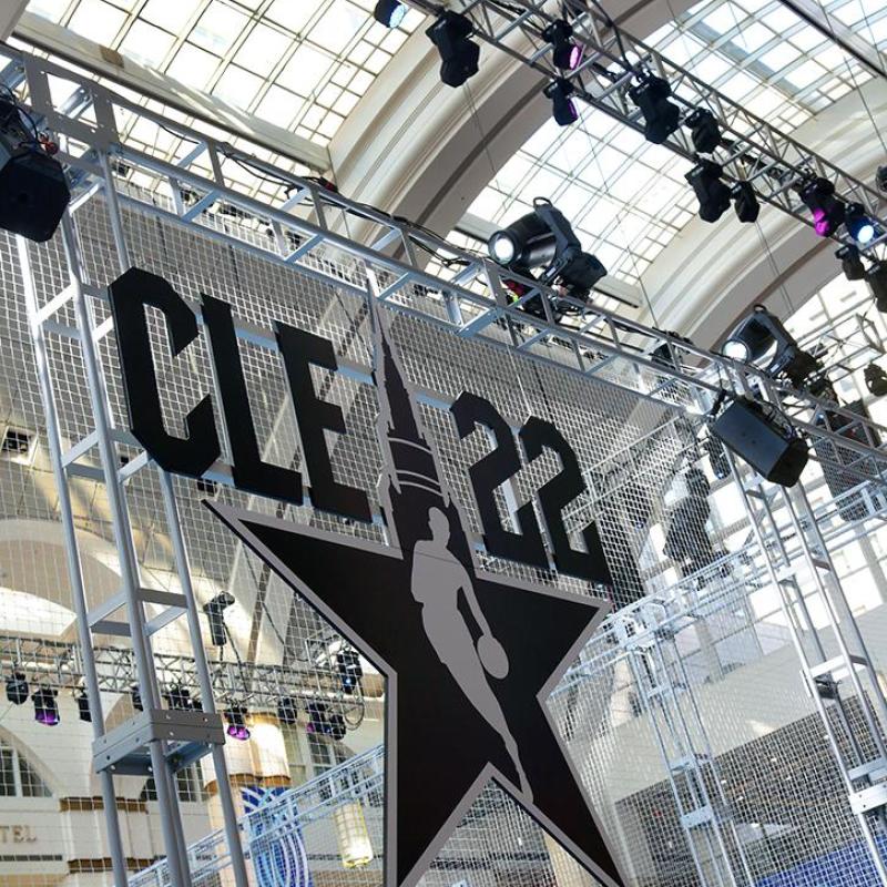 cleveland all star logo with basketball nets in the background