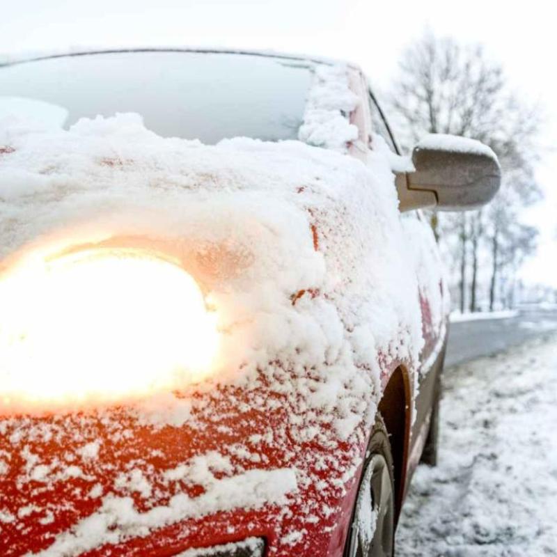 close up of car covered with snow