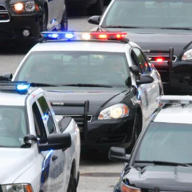 police cars on road 