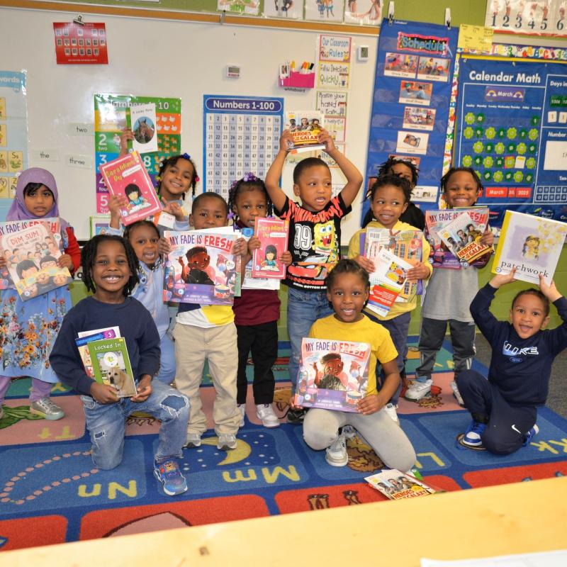 Kids with books at Wade Park School