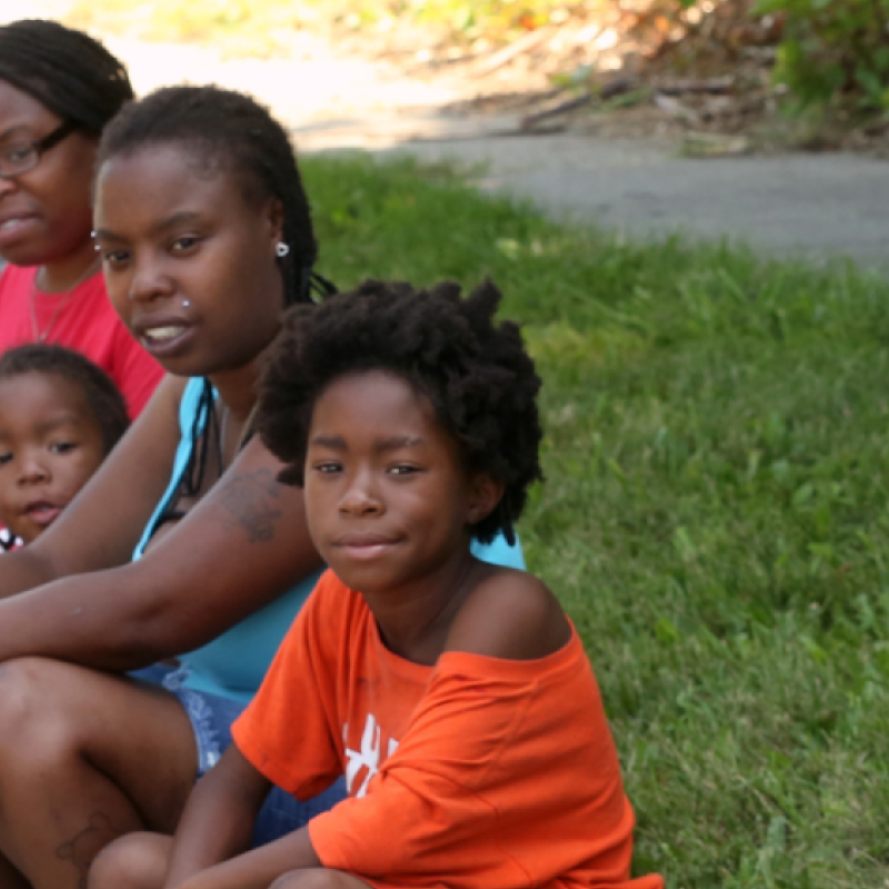group of children sitting on grass