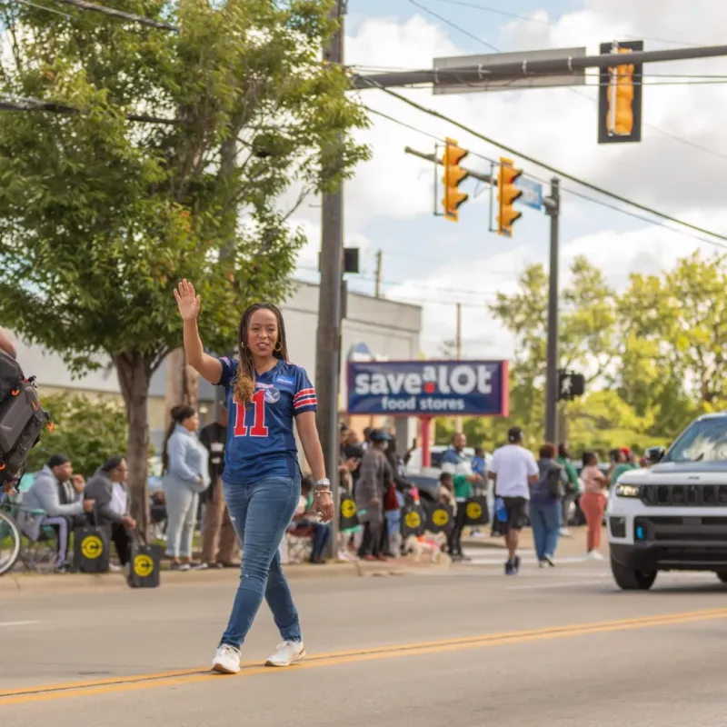 Woman Waving at Labor Day Parade