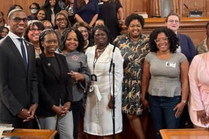 a group of women surround mayor bibb 