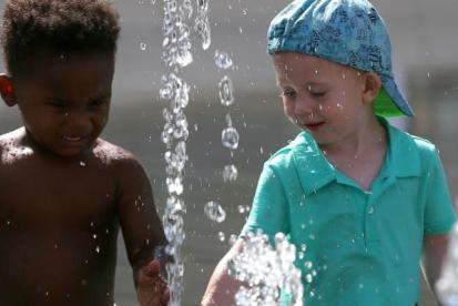 children playing in a fountain
