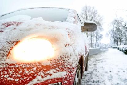 close up of car covered with snow