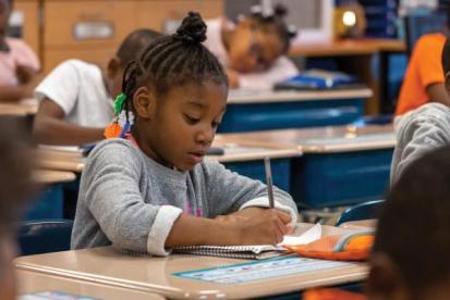 children learning at school desks