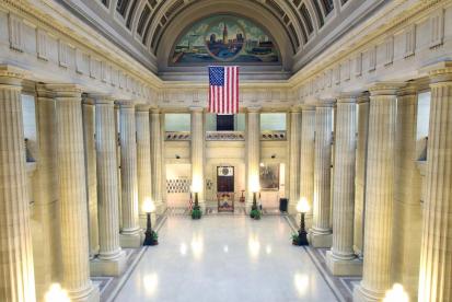 city hall with american flag visible in the background