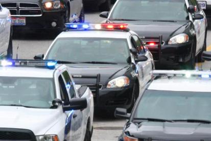 police cars on road 