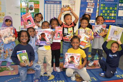 Kids with books at Wade Park School