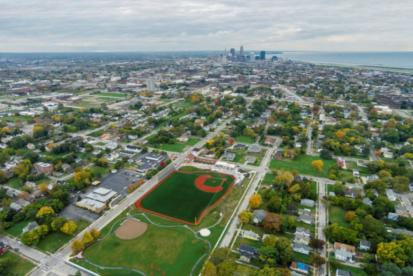 Aerial sky view of East 66th Street showing the Baseball Heritage Park Field and Downtown Cleveland in distance