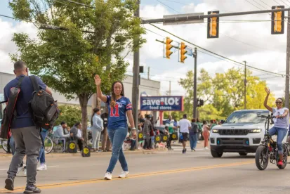 Woman Waving at Labor Day Parade
