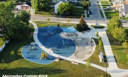 Aerial view of Mercedes Cotner Park with a new blue playground and a winding path with new trees along it.