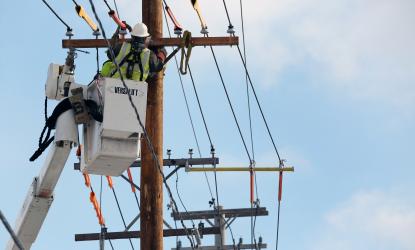 Photo of powerlines and workers.
