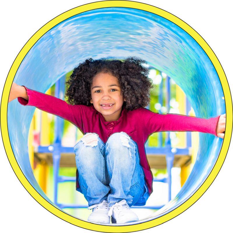 Child in playground tube