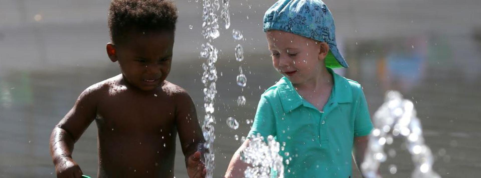 children playing in a fountain