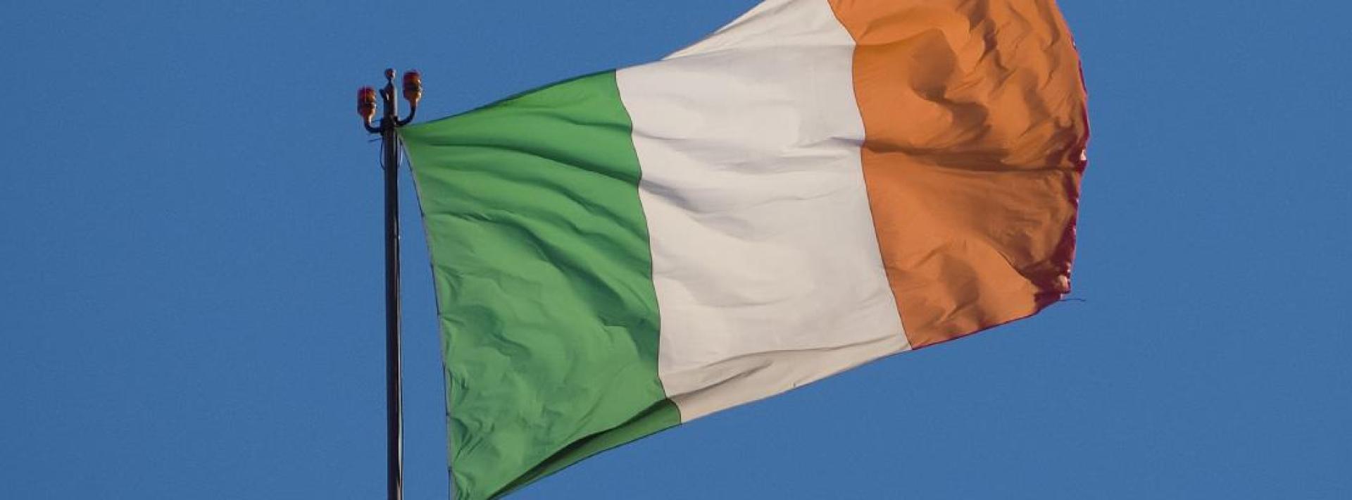 Irish flag against blue background