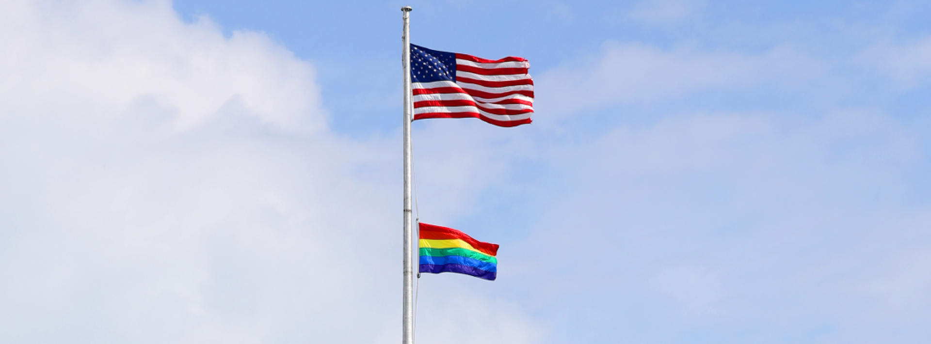 american flag and lgbtq flag