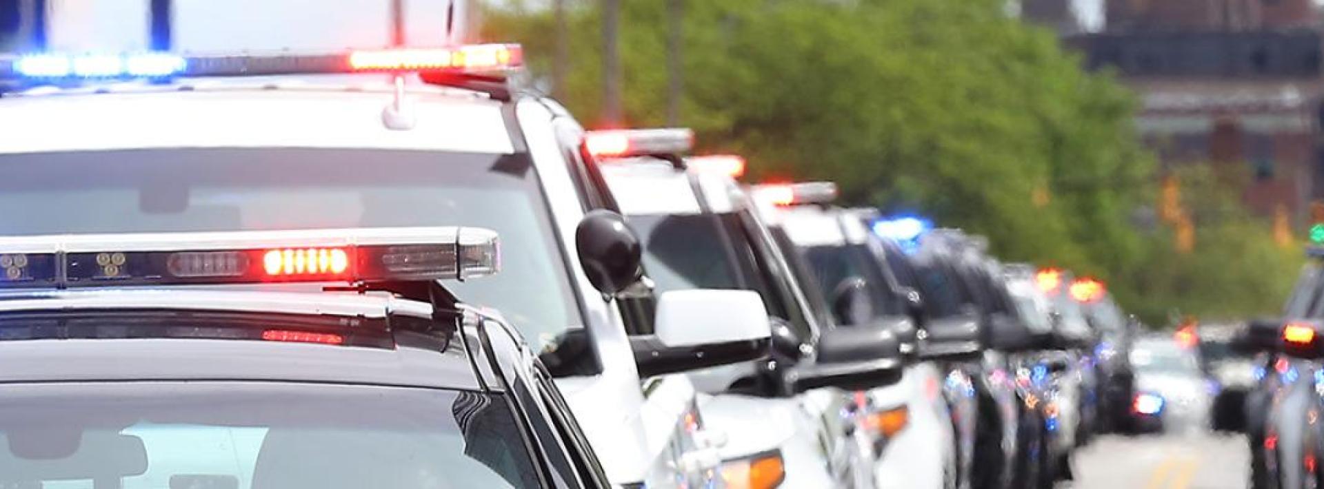 lineup of police cars on the street