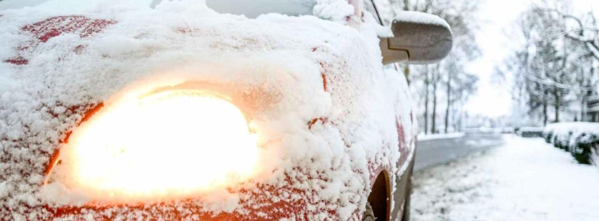 close up of car covered with snow