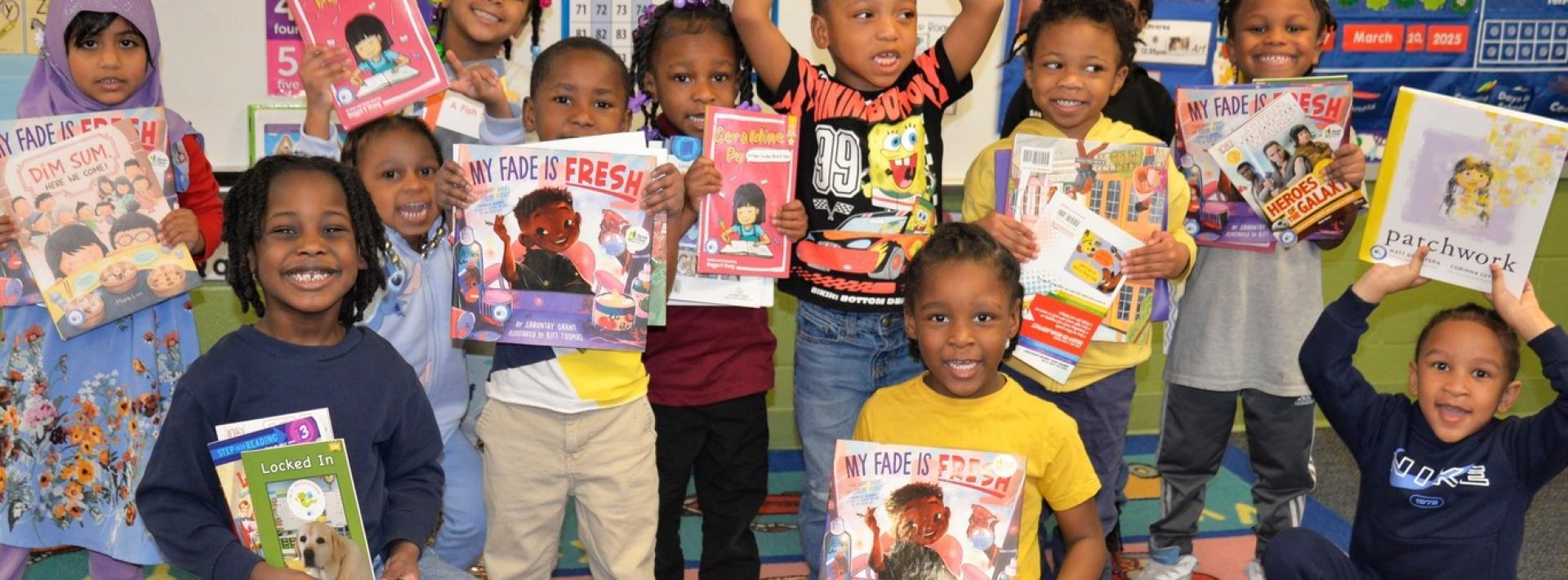 Kids with books at Wade Park School