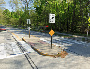 An example of a crosswalk with a pedestrian refuge island on MLK Jr. Drive within the Cleveland Cultural Gardens. 