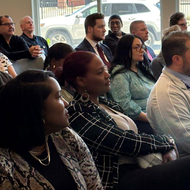 Residents listening to a presentation about fair housing
