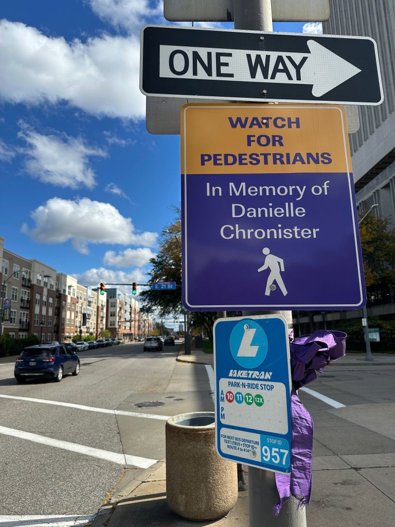Example of memorial sign; sign reads "Watch for pedestrians, In memory of Danielle Chronister"