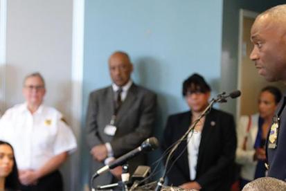 police accountability announcement happens in a room of people